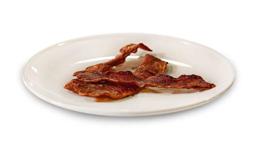 plated mushroom-based bacon