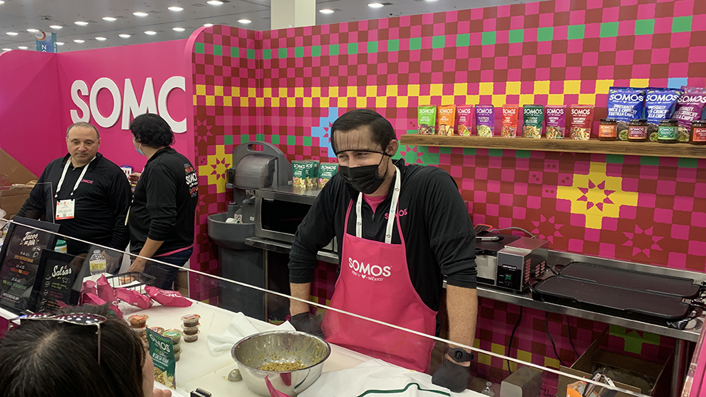 A chef preparing samples at SOMOS' booth at Expo West 2022