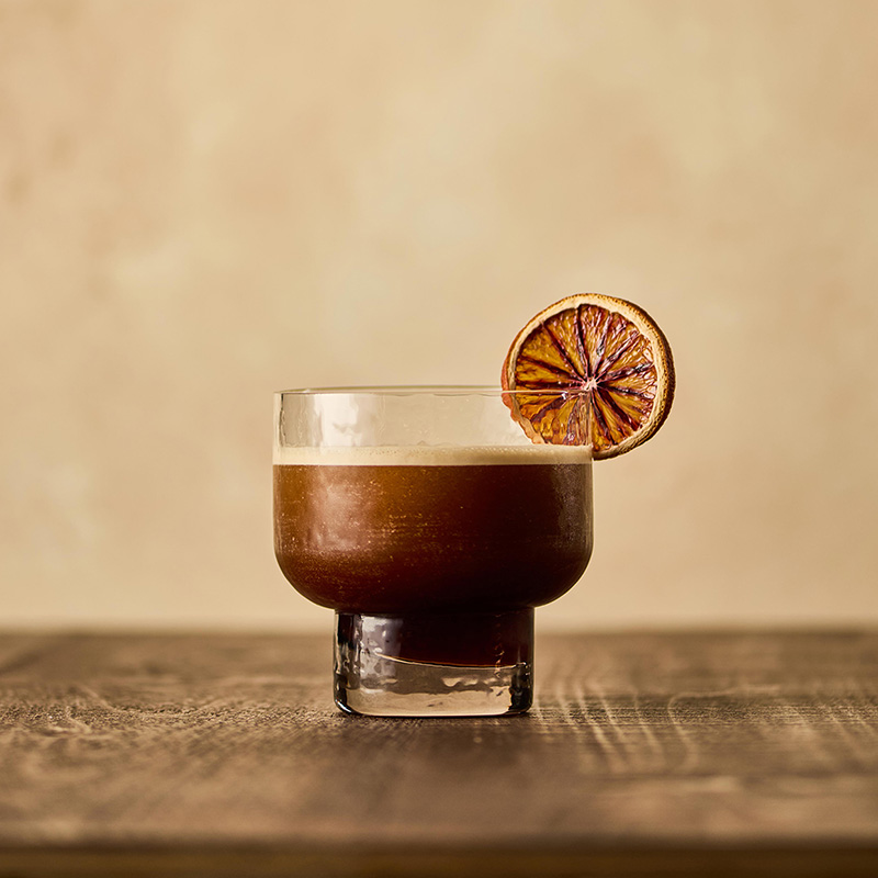 a carajillo with dried citrus garnish